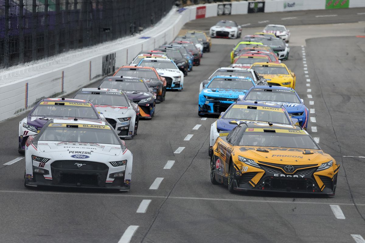 Christopher Bell, driver of the #20 DeWalt Toyota, leads the field during the NASCAR Cup Series Xfinity 500 at Martinsville Speedway on October 30, 2022 in Martinsville, Virginia.