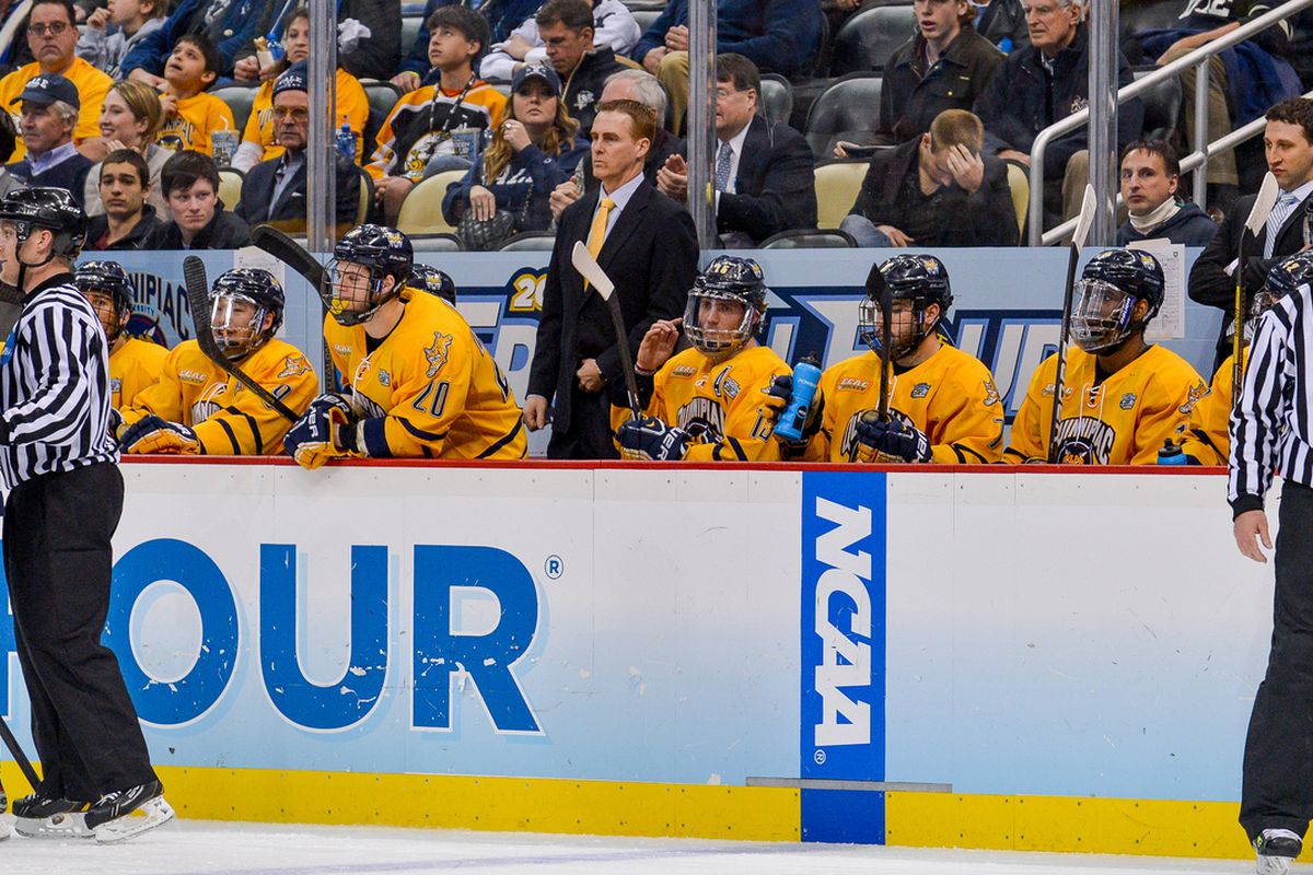 Rand Pecknold, seen here on the bench at the Frozen Four, and his staff continue to dominate the recruiting trail.