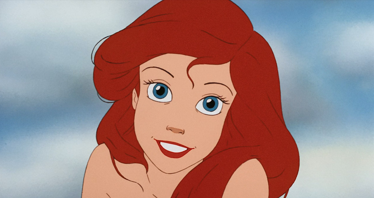 Ariel smiles directly into the camera in a close-up from the animated 1989 Little Mermaid