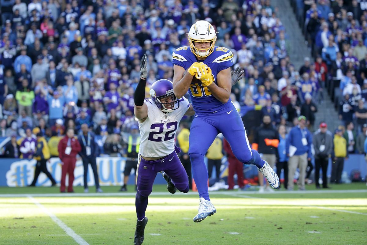 Hunter Henry of the Los Angeles Chargers catches a pass while defended by free safety Harrison Smith of the Minnesota Vikings in the third quarter at Dignity Health Sports Park on December 15, 2019 in Carson, California.