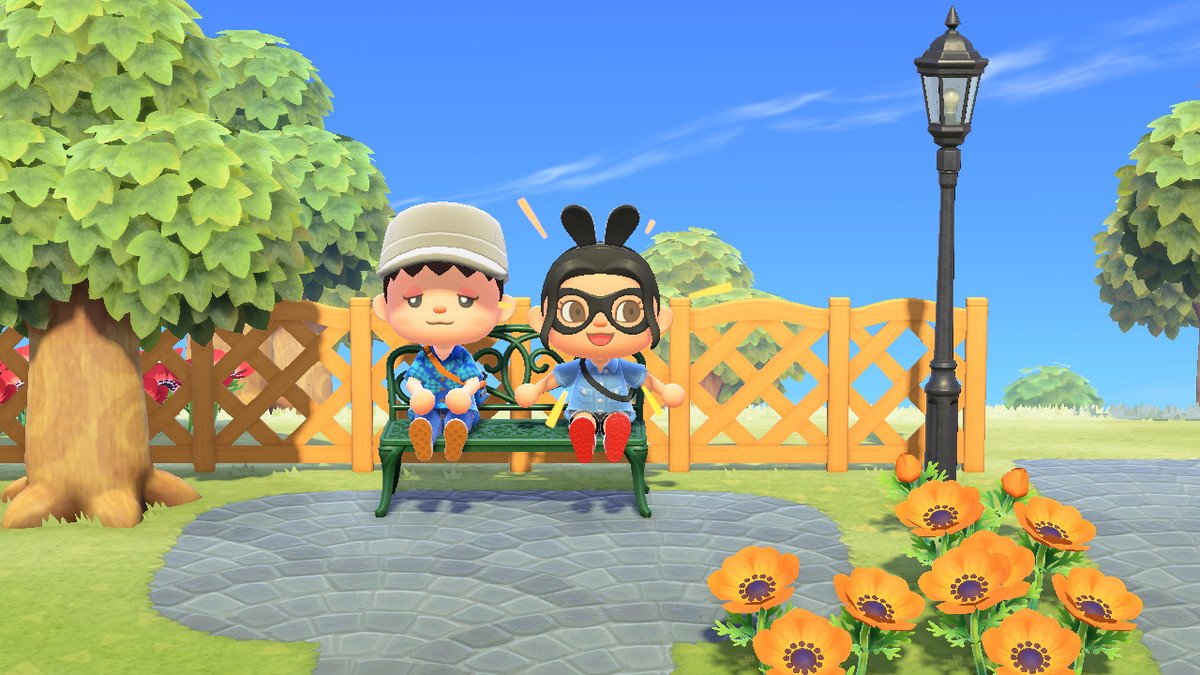 Two Animal Crossing characters sitting together on a bench