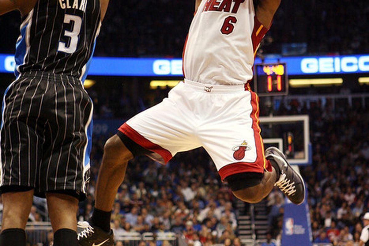 ORLANDO FL - FEBRUARY 03: Forward LeBron James of the Miami Heat shoots over Forward Earl Clark of the Orlando Magic at Amway Arena on February 3 2011 in Orlando Florida.  (Photo by Marc Serota/Getty Images)