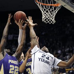 BYU guard Frank Bartley IV (24) and Prairie View A&M Panthers forward Rasi Jenkins (22) fight for a rebound along with Prairie View A&M Panthers center Reggis Onwukamuche (35) and Brigham Young Cougars forward Nate Austin (back) during a game at the Marriott Center in Provo on Wednesday, Dec. 11, 2013.