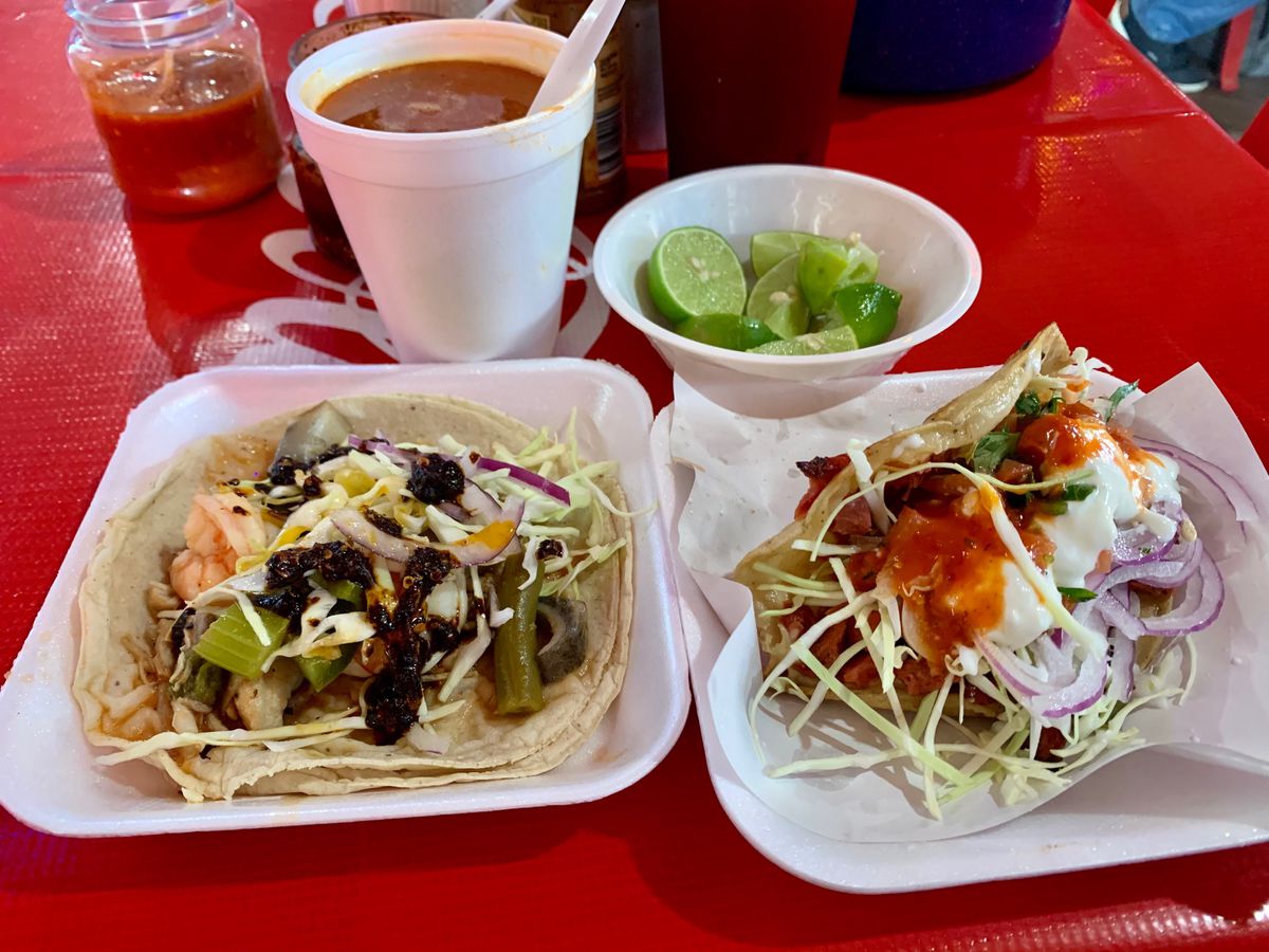 Two plates of tacos.