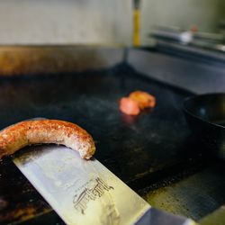 Rather than using the heart attack on a plate that is the average English banger, Dilda grills a Cumberland sausage made in house with just a few simple ingredients: rye bread, pork, caraway, and mustard seed.