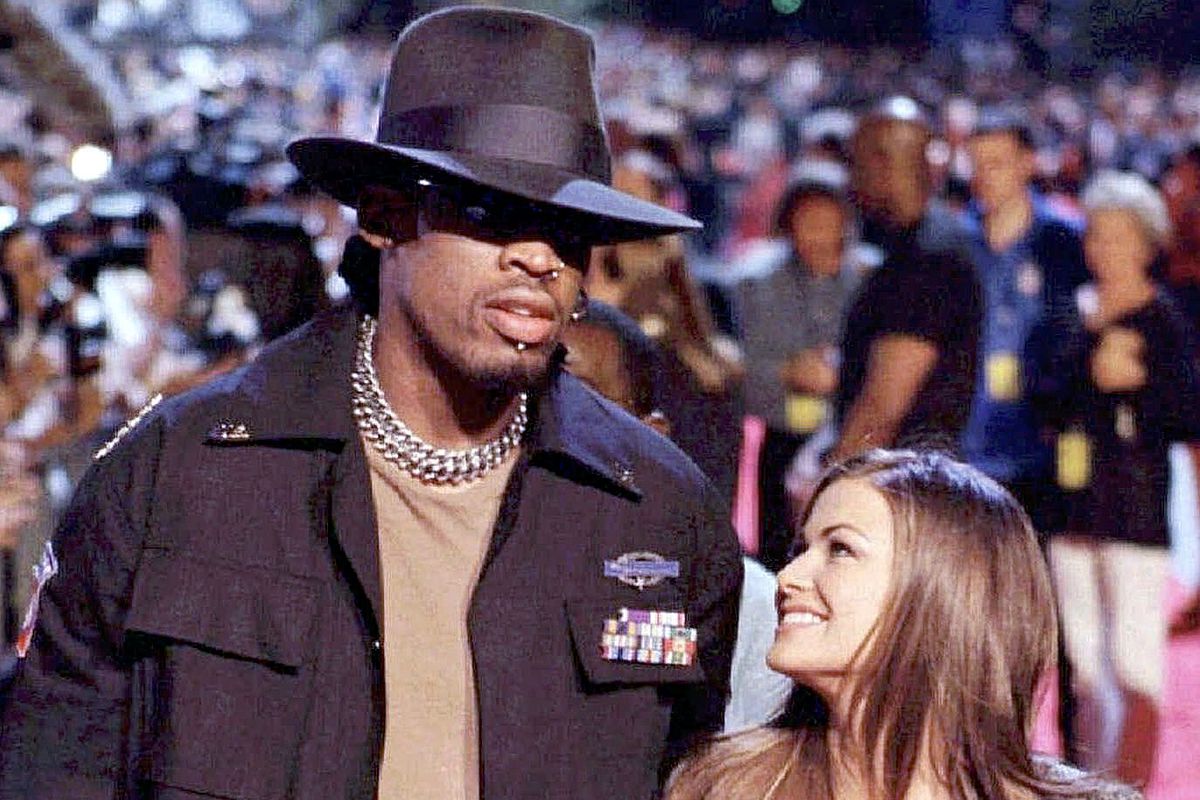 Dennis Rodman and actress Carmen Electra are shown arriving at the opening of the Planet Hollywood restaurant in Montreal in this July 27, 1998 file photo.