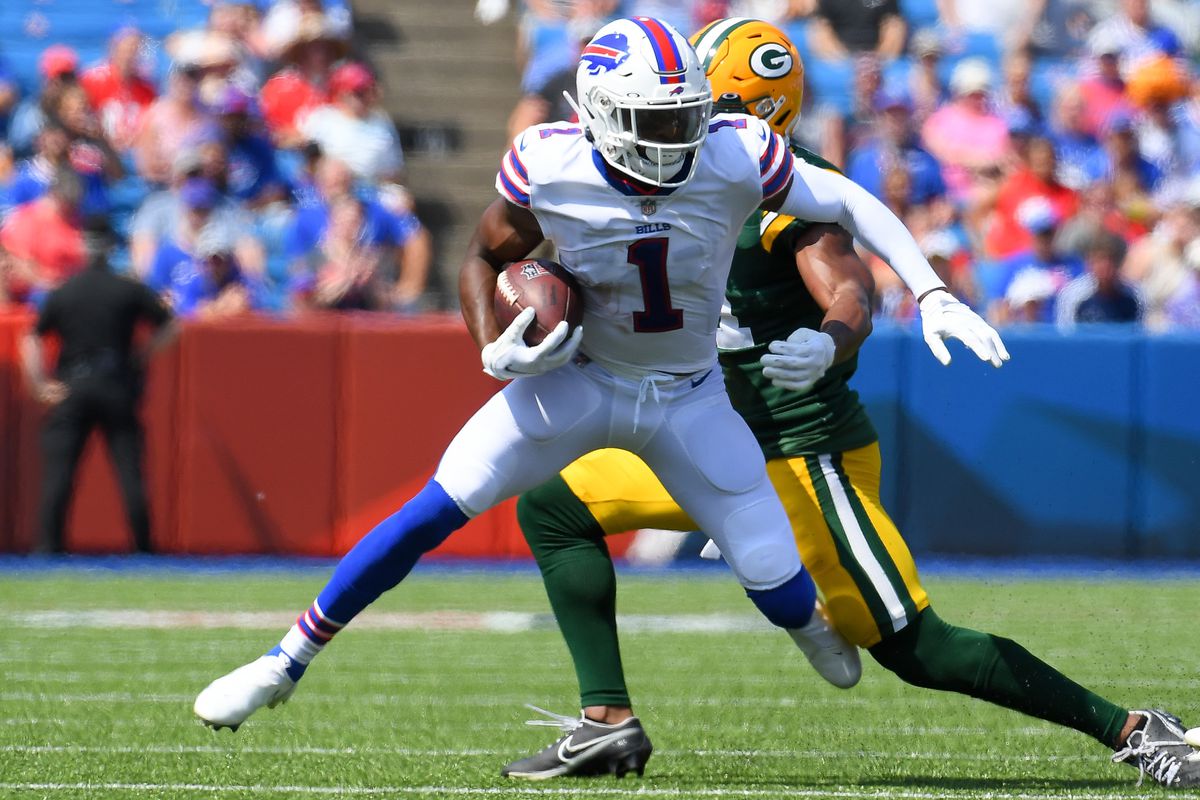 Buffalo Bills wide receiver Emmanuel Sanders (1) runs with the ball after a catch as Green Bay Packers safety Henry Black (back) defends during the first quarter at Highmark Stadium.