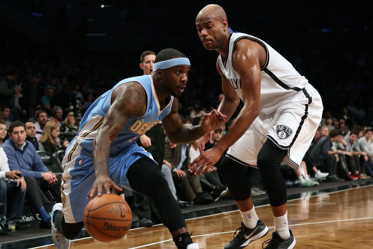 Ty Lawson (L) and the Denver Nuggets led early, but went ice-cold late in the loss against the Brooklyn Nets.