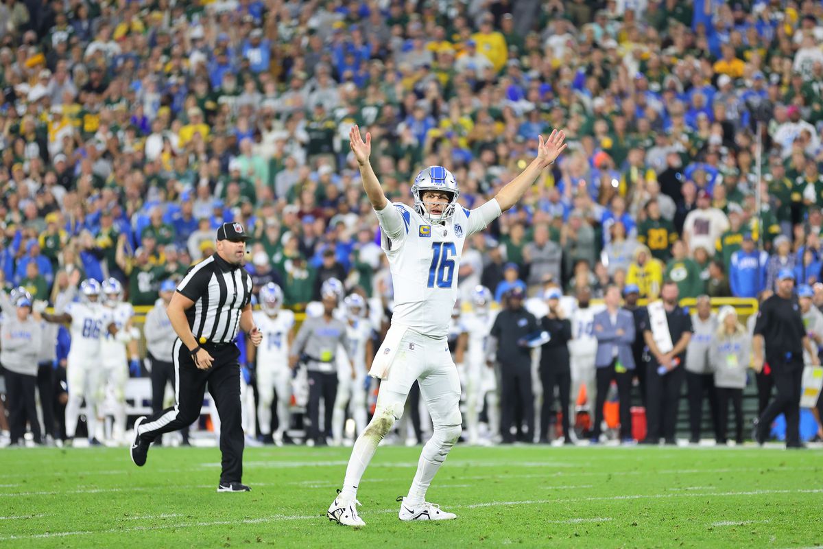 Jared Goff #16 of the Detroit Lions celebrates a touchdown during a game against the Green Bay Packers at Lambeau Field on September 28, 2023 in Green Bay, Wisconsin.