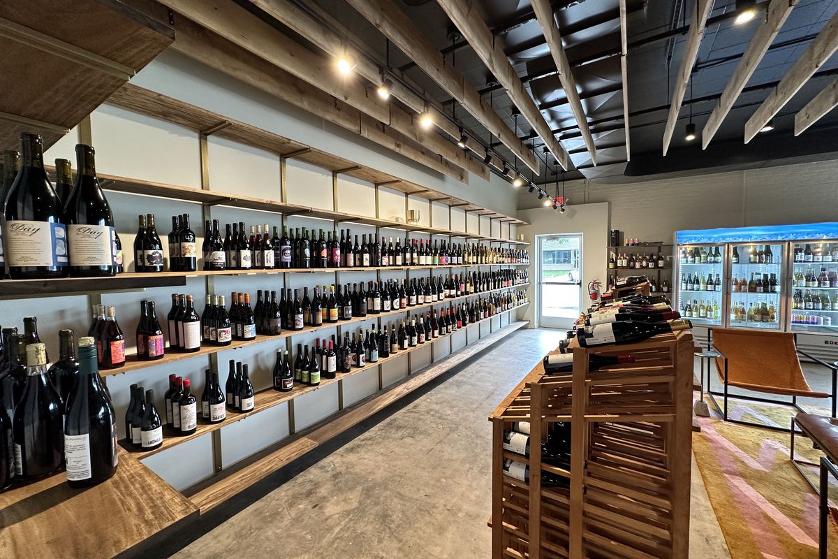 A wine store with bottles on shelves.