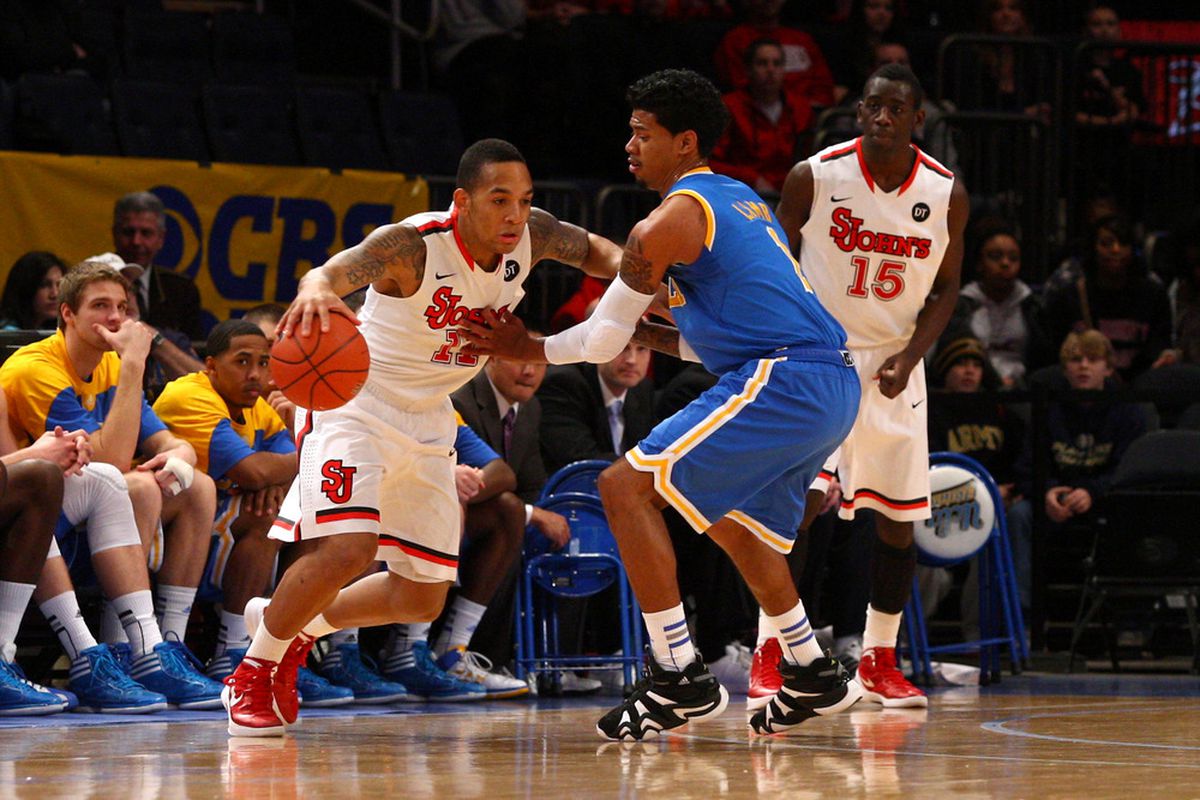 NEW YORK, NY - FEBRUARY 18:  D'Angelo Harrison #11 of the St. John's Red Storm drives in the first half against Tyler Lamb #1 of the UCLA Bruins at Madison Square Garden on February 18, 2012 in New York City.  (Photo by Chris Chambers/Getty Images)