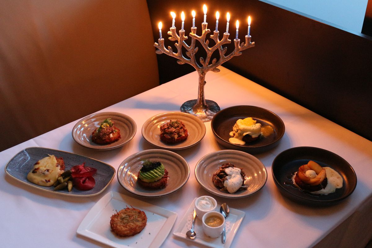 Plates of latke and candles.
