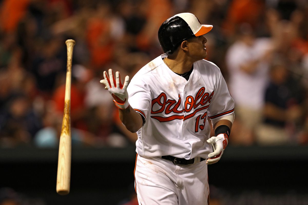 Manny Machado flips his bat after hitting a home run.