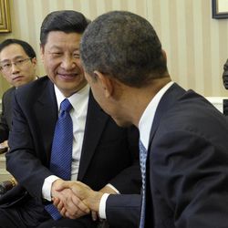 In this Feb. 14, 2012 file photo, President Barack Obama and Chinese Vice President Xi Jinping, left, shake hands as they engage with media during their Oval Office meeting at the White House in Washington. When Obama and Jinping meet again at week's end for an unusual two-day summit at a Southern California estate, Obama will be looking for signs of seriousness in China's recent private pledges to address cyberhacking, which he has said is a rapidly growing threat to U.S. national security. This while keeping present that it is China, whose help will be needed to stem nuclear threats from North Korea and Iran, to curtail the violence in Syria, and to build on the U.S. economic recovery.