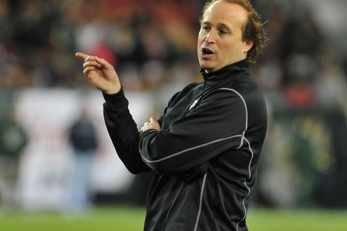 TAMPA, FL - DECEMBER 1:  Coach Dana Holgorsen of the West Virginia Mountaineers shows all the fucks he does not give Thursday night against South Florida. (Photo by Al Messerschmidt/Getty Images)