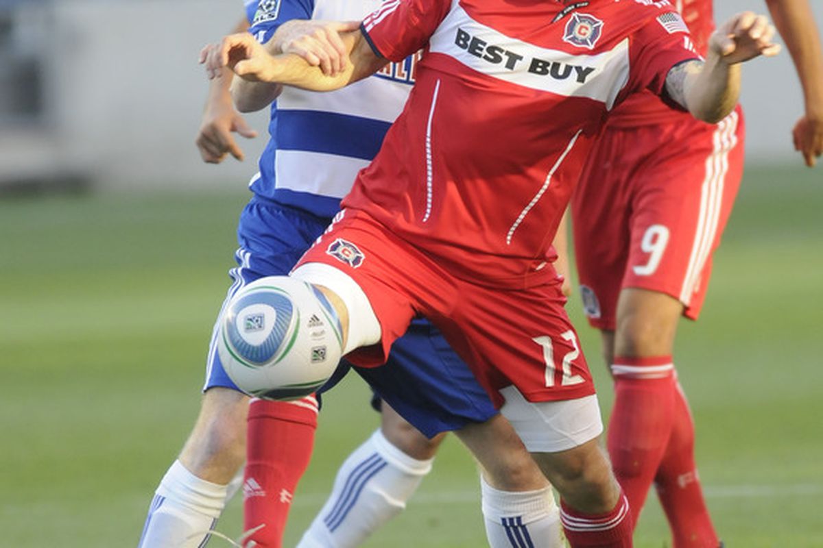 BRIDEVIEW, IL - MAY 27: Logan Pause #12 of the Chicago Fire is defended by Dax McCarty #13 of FC Dallas in an MLS match on May 27, 2010 at Toyota Park in Brideview, Illinois. (Photo by David Banks/Getty Images)