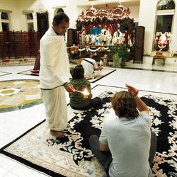 Participants begin a yoga class at the Hare Krishna Temple in Spanish Fork  Sunday, Nov. 20, 2011.  The class is for people in the community, from troubled teens to pre-missionaries and not just stretching and downward dog, but a chance to renew and find greater connection to God. 