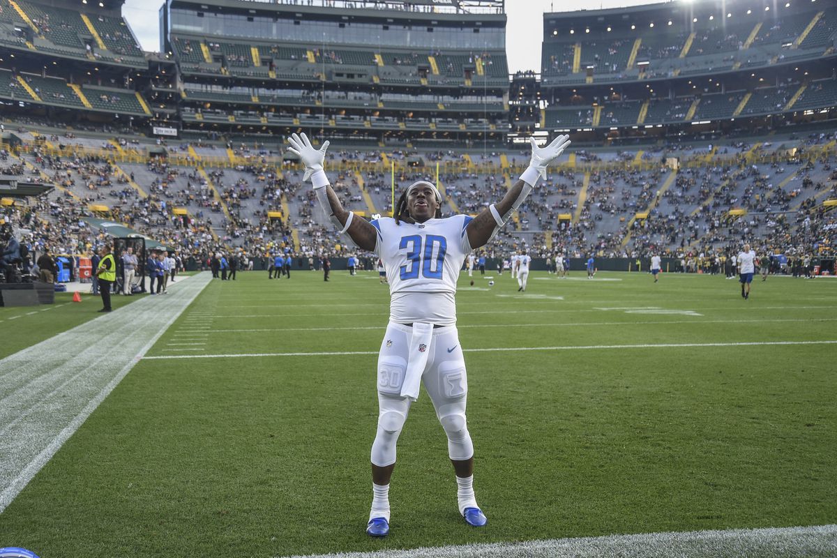 NFL: Detroit Lions at Green Bay PackersDetroit Lions running back Jamaal Williams (30) greets fans before a game against the Green Bay Packers at Lambeau Field.