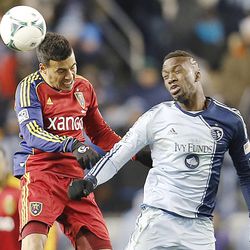Real's Javier Morales and Kansas City's C.J. Sapong head the ball as Real Salt Lake and Sporting KC play Saturday, Dec. 7, 2013 in MLS Cup action. Sporting KC won in a shootout.