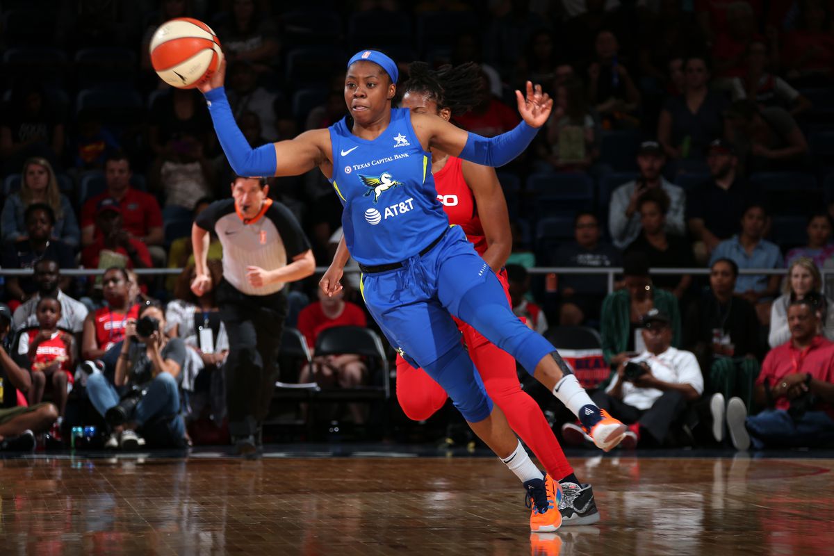 Arike Ogunbowale of the Dallas Wings passes the ball against the Washington Mystics on September 6, 2019 at the St. Elizabeths East Entertainment and Sports Arena in Washington, DC.&nbsp;