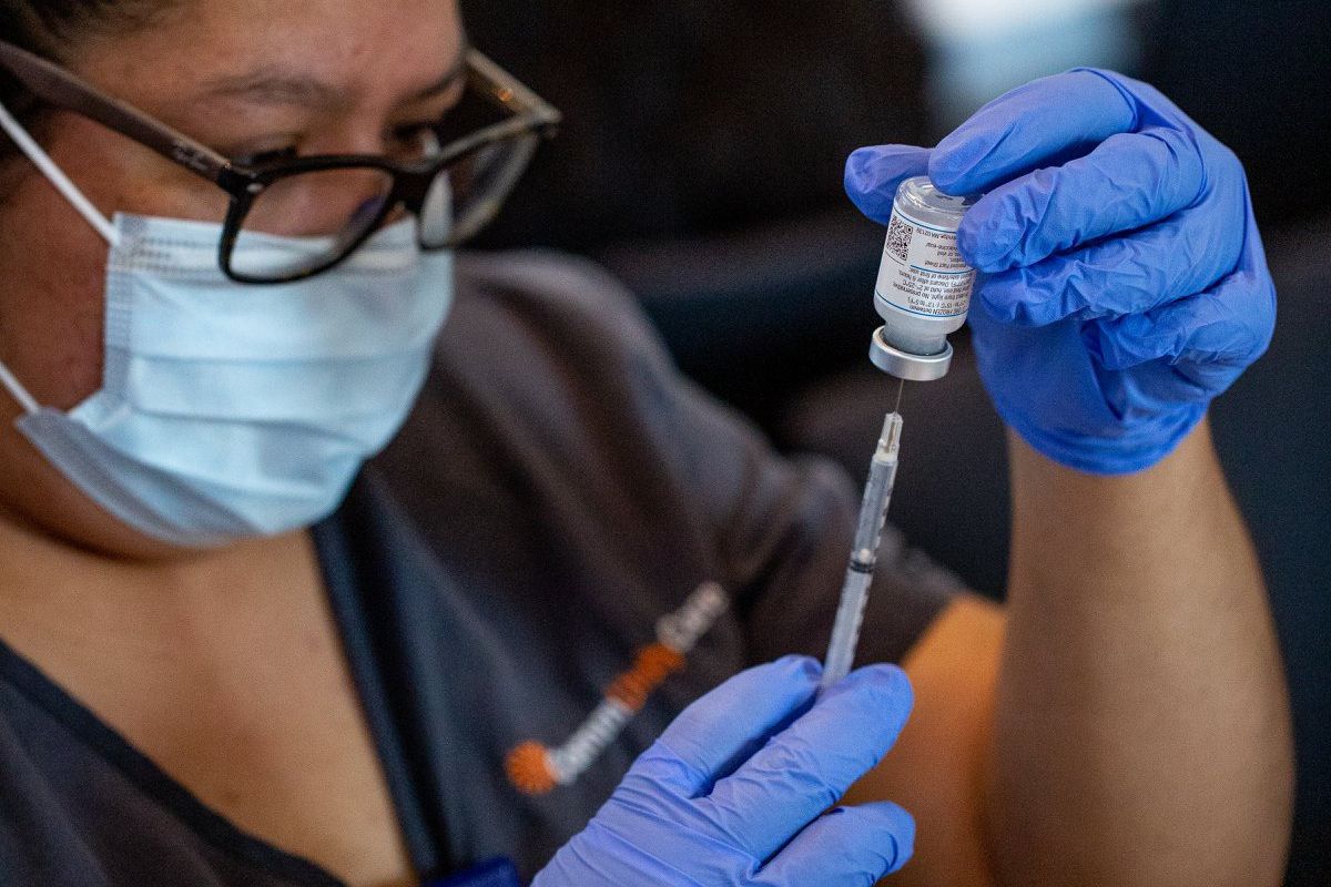 A person preparing vaccinations at Circuit of the Americas