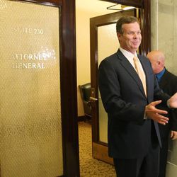 Utah Attorney General John Swallow speaks to the media after a Republican House Caucus meeting to discuss impeachment at the Capitol in Salt Lake City Wednesday, June 19, 2013.