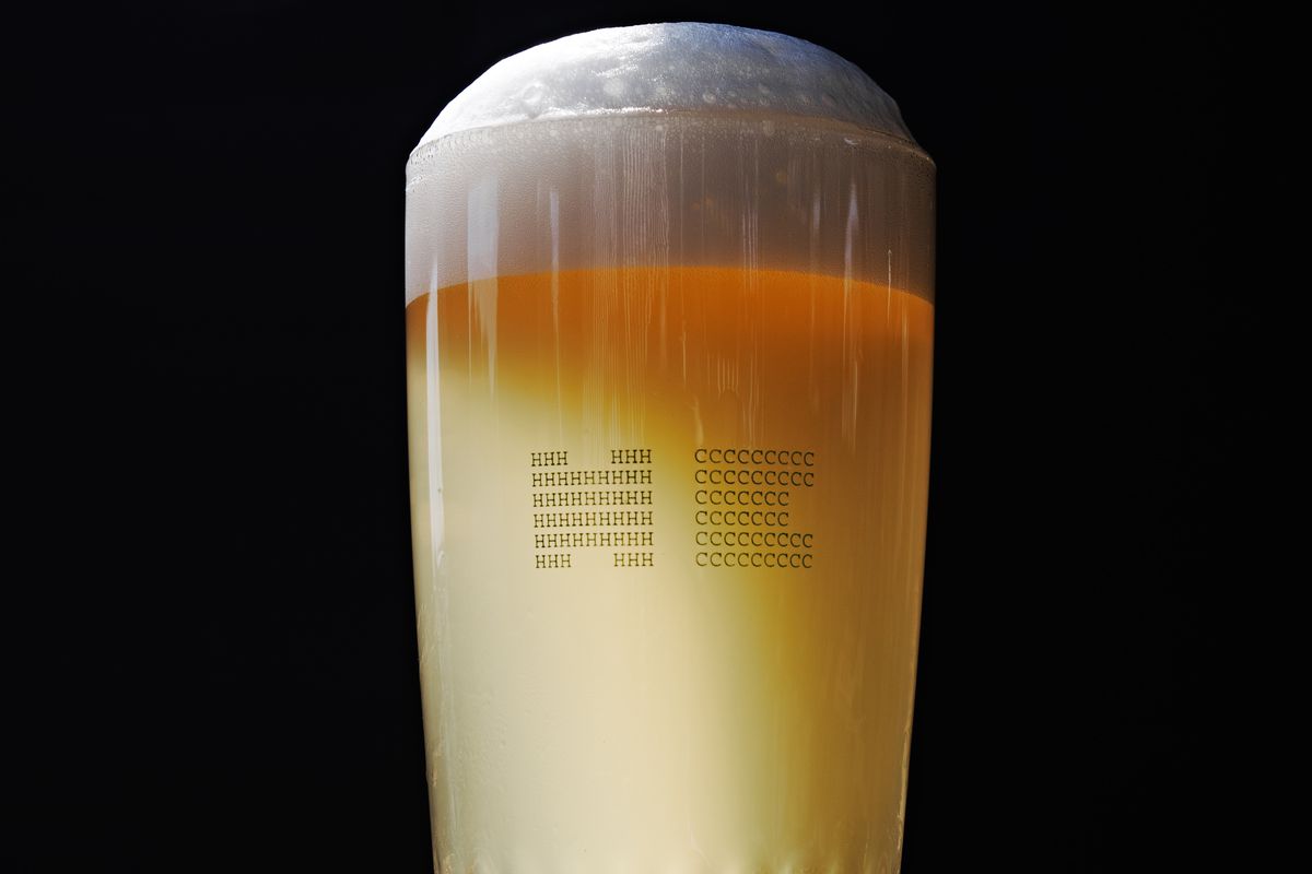 A pint of beer with head against a black background at Halfway Crooks Brewing in Summerhill