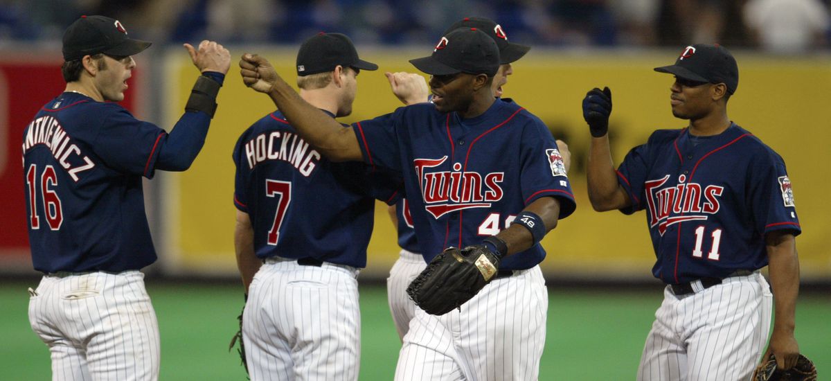Minneapolis, MN., Wednesday, 5/28/2003. (left to right) Minnesota Twins Doug Mientkiewicz, Denny Hocking, Torii Hunter, and Jacque Jones celebrated their win over Oakland.