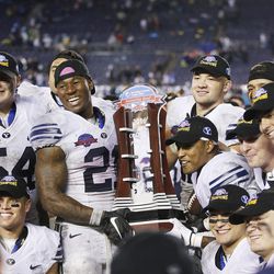 Brigham Young Cougars celebrate their win over the Wyoming Cowboys during the Poinsettia Bowl in San Diego on Wednesday, Dec. 21, 2016. BYU won 24-21.