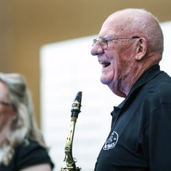 The Mixed Nuts band leader Bob Nohavec laughs with singer Robin Gomez during a gig at the Legacy Retirement Residence in South Jordan on Tuesday, Sept. 3, 2019.