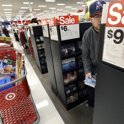 Paul Poirier shops for sales at Target on Black Friday, Nov. 25, 2016, in Wilmington, Mass. Stores open their doors Friday for what is still one of the busiest days of the year, even as the start of the holiday season edges ever earlier. 