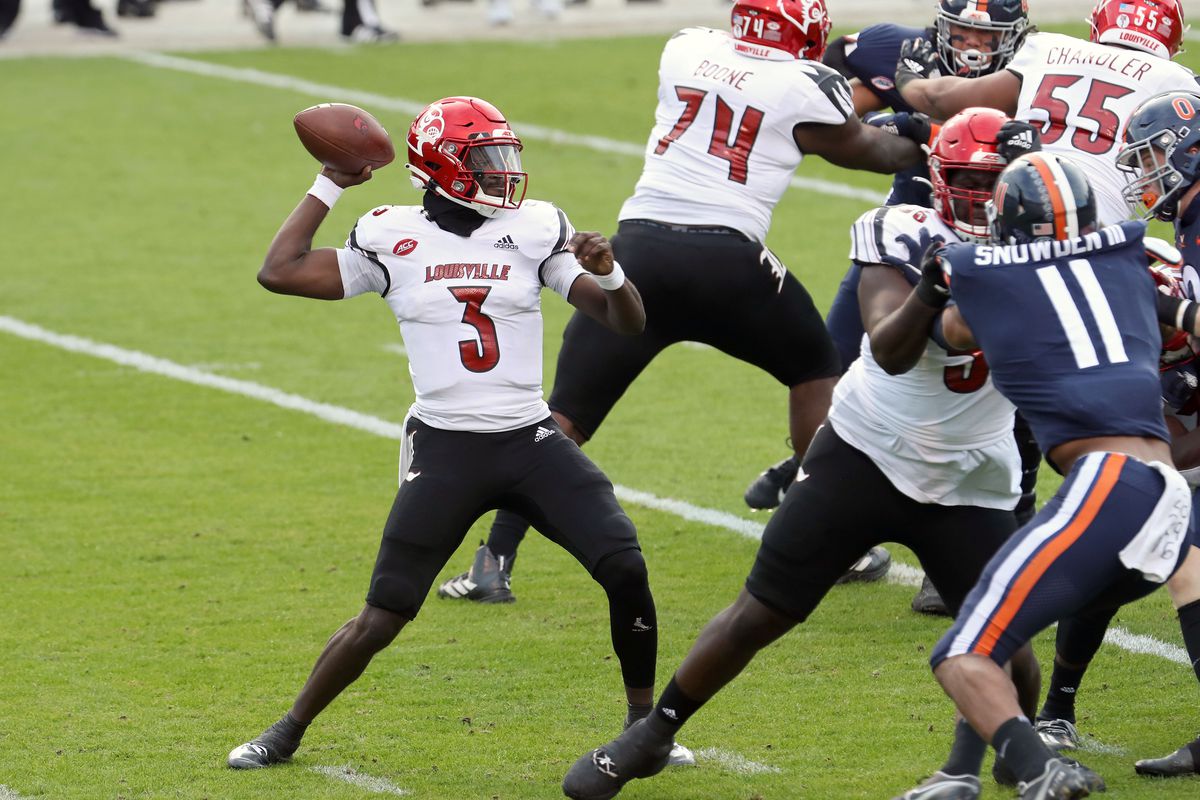 Malik Cunningham of the Louisville Cardinals throws a pass in the first half during a game against the Virginia Cavaliers at Scott Stadium on November 14, 2020 in Charlottesville, Virginia.