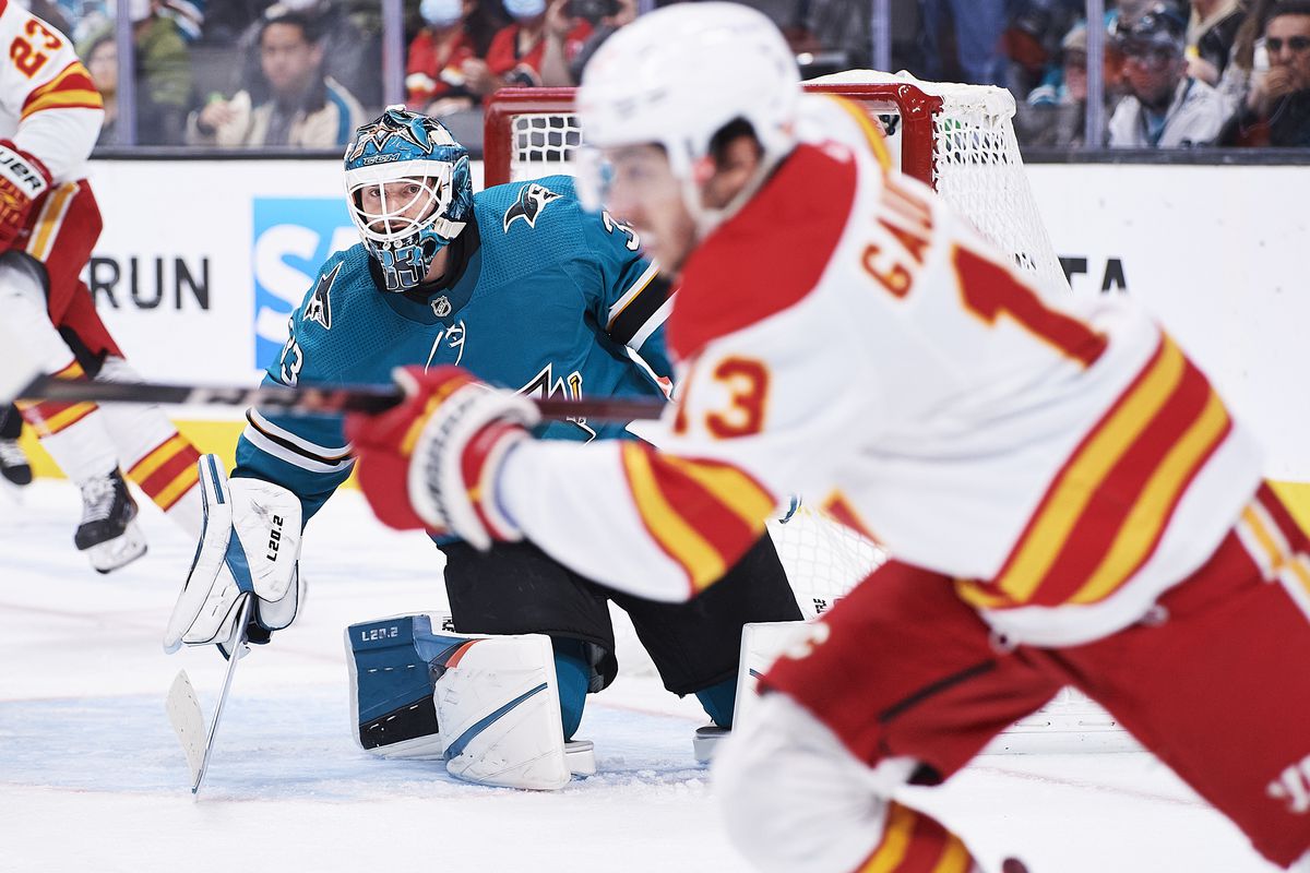 San Jose Sharks goaltender Adin Hill (33) tracks the puck during the NHL game between the San Jose Sharks and the Calgary Flames on December 7, 2021 at SAP Center in San Jose, CA.