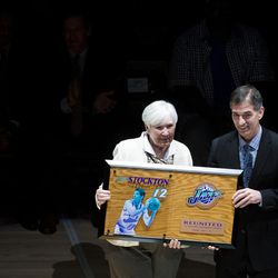 Gail Miller presents former John Stockton with a plaque during a halftime ceremony celebrating the 1997 Utah Jazz at Vivint Smart Home Arena in Salt Lake City on Wednesday, March 22, 2017.