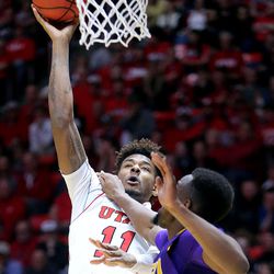 LSU Tigers forward Aaron Epps (21) fouls Utah Utes forward Chris Seeley (11) as he shoots during a men's basketball game at the Huntsman Center in Salt Lake City on Monday, March 19, 2018. Utah won 95-71.