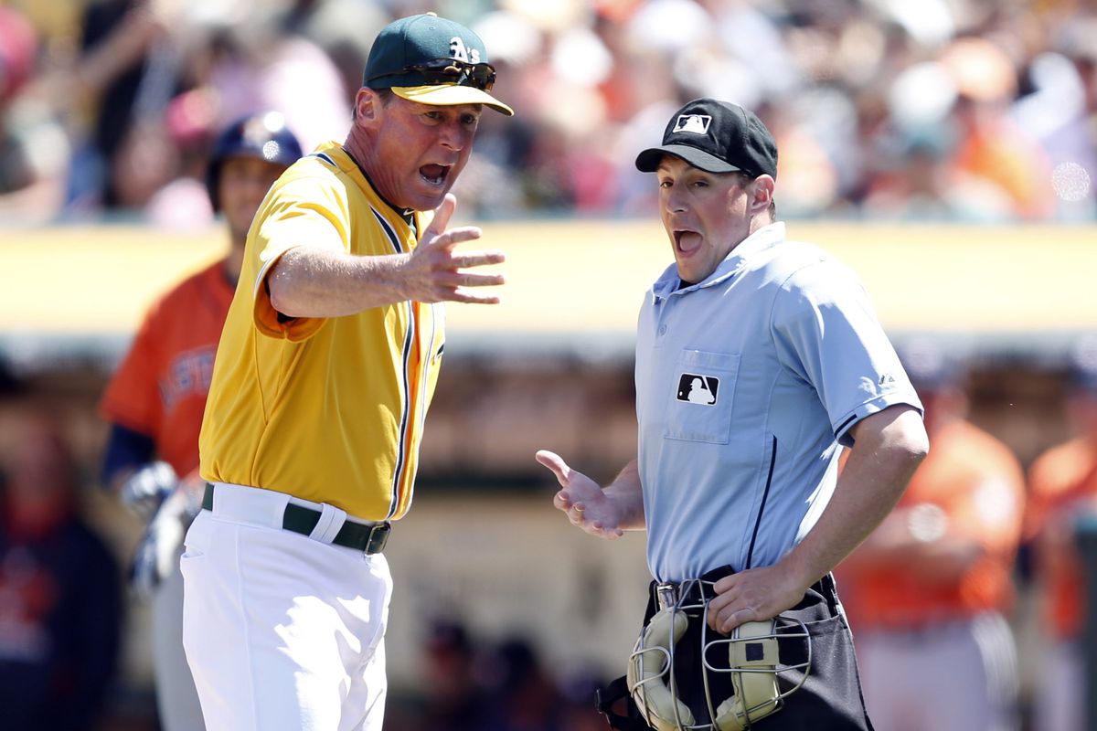Bob Melvin argues with home plate umpire Quinn Wolcott after Wolcott ejected Melvin for arguing balls and strikes.