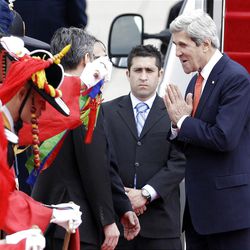 U.S. Secretary of State John Kerry, right, greets upon his arrival at Seoul military airport in Seongnam, South Korea, Friday, April 12, 2013. Kerry is traveling directly into a region bracing for a possible North Korean missile test and risking that his presence alone could spur Pyongyang into another headline-seeking provocation. (AP Photo/Lee Jin-man)