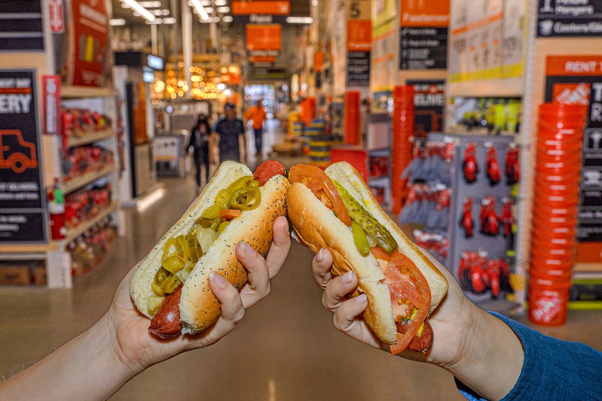 Two hot dogs kissing buns in a hardware store’s aisle.