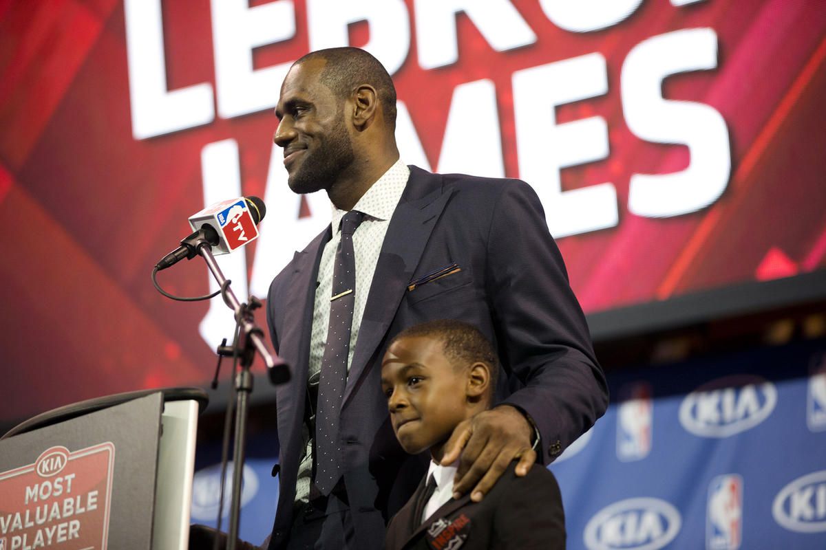 LeBron James stands with his son, LeBron Jr., during an NBA basketball news conference, Sunday, May, 5, 2013, in Miami.