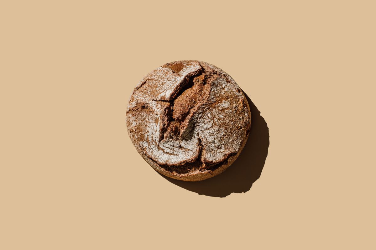 A loaf of bread against a brown background.