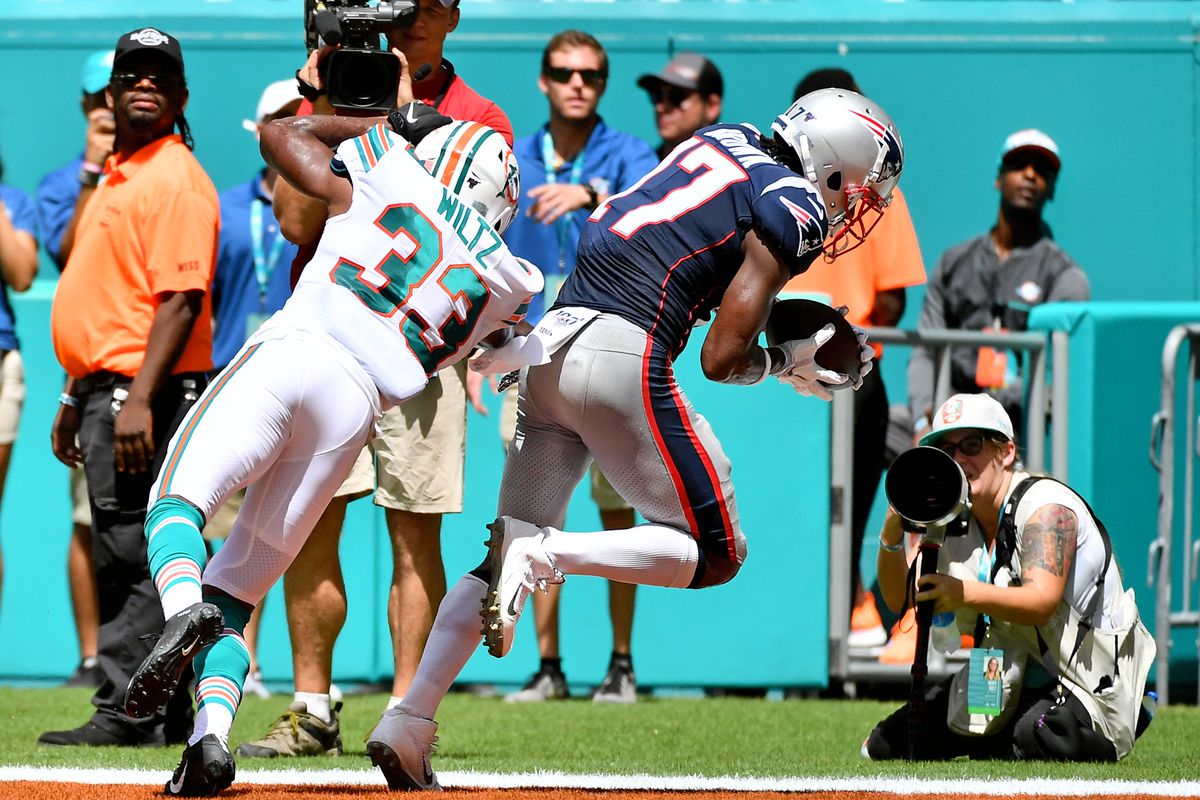 New England Patriots wide receiver Antonio Brown makes a catch for a touchdown against the Miami Dolphins during the first half at Hard Rock Stadium.