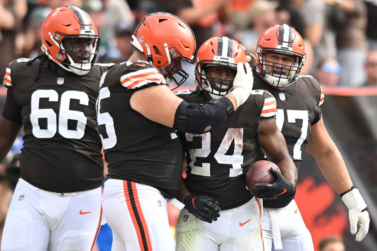 Nick Chubb #24 of the Cleveland Browns is congratulated after scoring a touchdown against the New York Jets by Joel Bitonio #75 during the fourth quarter at FirstEnergy Stadium on September 18, 2022 in Cleveland, Ohio.