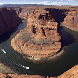 In a Wednesday, March 5, 2008 file photo, water levels at the Colorado River's Horseshoe Bend begin to rise along the beaches just hours after the Glen Canyon Dam jet tubes began releasing water, in Page, Ariz.  The Colorado River is the No. 1 most endangered river in the country because of the critical public policy decisions impacting it in the next year  from new dams to proposed diversions. The river is already over-allocated, calling into question the ability of the river to meet future demands.