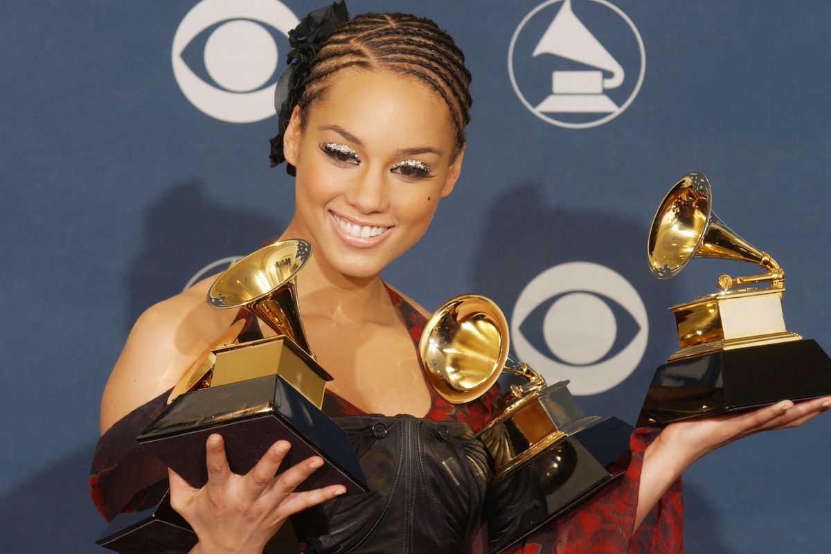 Alicia Keys holds her 2002 Grammys, one of which was for Best Female R&amp;B Vocal Performance, an award that no longer exists.&nbsp;