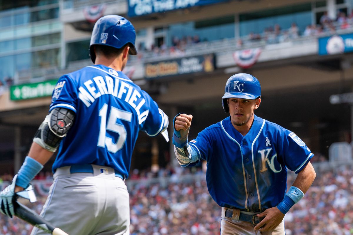 Kansas City Royals second baseman Nicky Lopez (1) celebrates his run with first baseman Whit Merrifield (15) in the seventh inning against Minnesota Twins at Target Field. Mandatory Credit: Brad Rempel