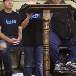 Chase Hansen, 9-year-old CEO of Kid Labs and a Leesa “social changemaker,” stands on his tiptoes to reach a microphone while speaking at athe Rescue Mission of Salt Lake on World Homeless Day in Salt Lake City on Wednesday, Oct. 10, 2018. Leesa Sleeps donated 150 mattresses to the mission.