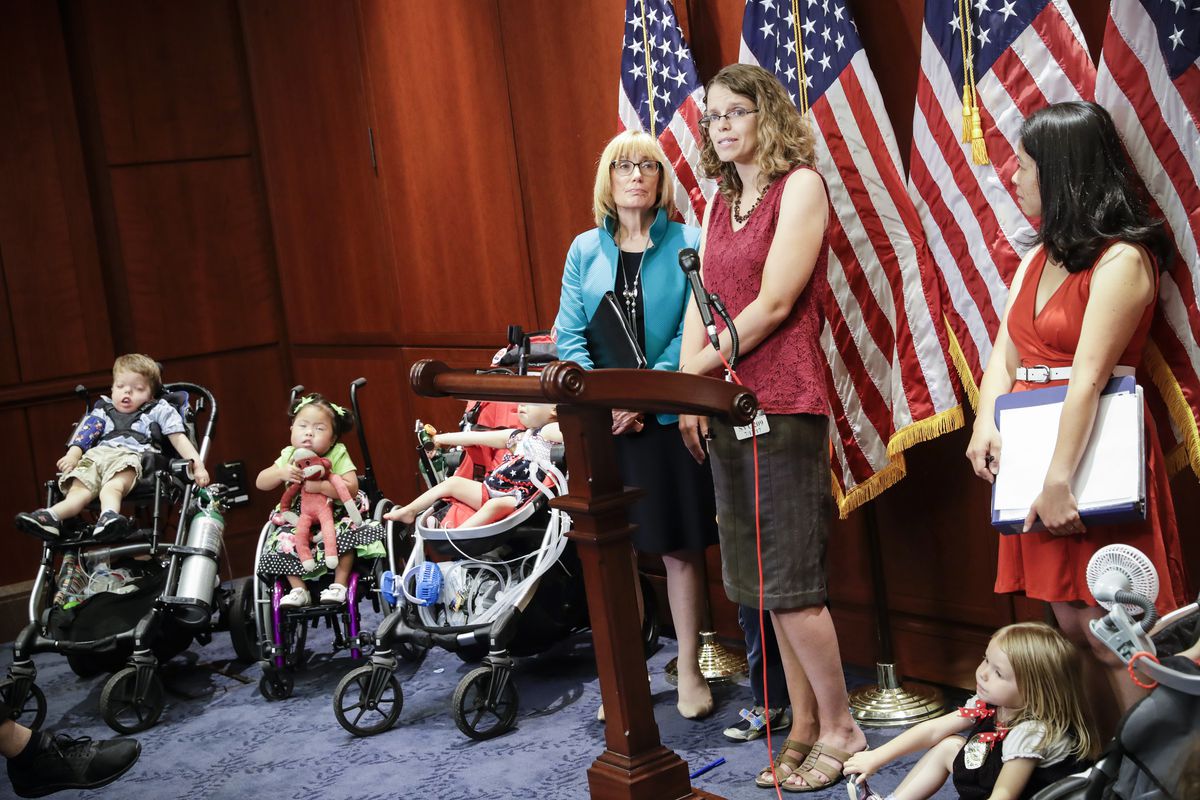 Sen. Maggie Hassan, (D-N.H.), (left), joins Michelle Morrison, (center) and other families of children with intensive health care needs as they speak against the Republican health care bill and, specifically, an amendment sponsored by Ted Cruz, (R-Texas),