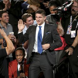 Duke's Grayson Allen makes his way to the stage after he was picked 21st overall by the Utah Jazz during the NBA basketball draft in New York, Thursday, June 21, 2018. (AP Photo/Kevin Hagen)