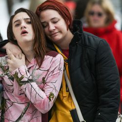 Khaiyla Comer, 13, an eighth-grade student at Mueller Park Junior High School, walks with her mother, Shannon Einzinger, after a shooting at the school in Bountiful on Thursday, Dec. 1, 2016.