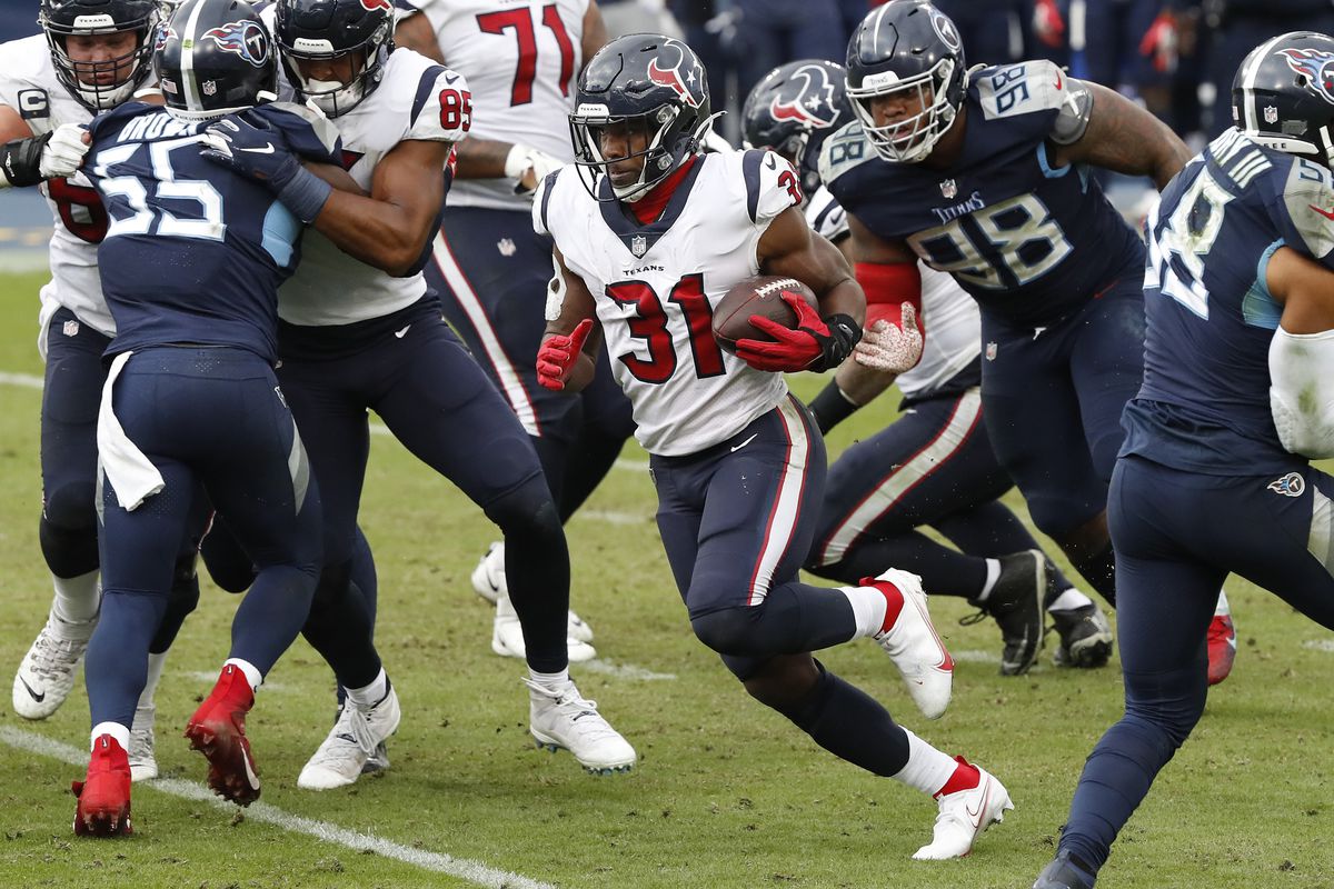 Running back David Johnson #31 of the Houston Texans runs with the ball in the second half of their game at Nissan Stadium on October 18, 2020 in Nashville, Tennessee.&nbsp;